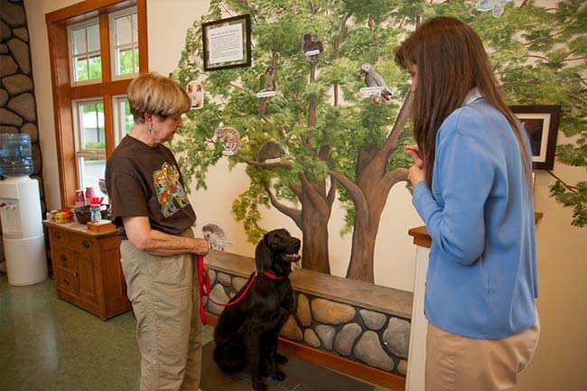 client with dog in lobby